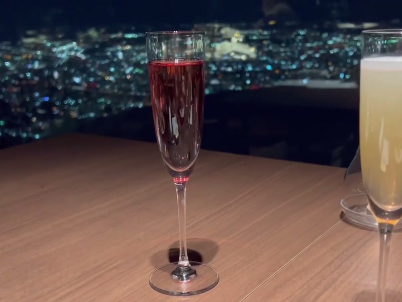 Two glasses at the window above the night view